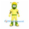 Green Alien Mascot Costume with Yellow Hair and Sports Outfit