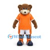 Bear Mascot Costume in Brown with Orange Sports Shirt and White Shorts