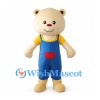 Cream Bear Mascot Costume with Blue Overalls and Yellow Shirt