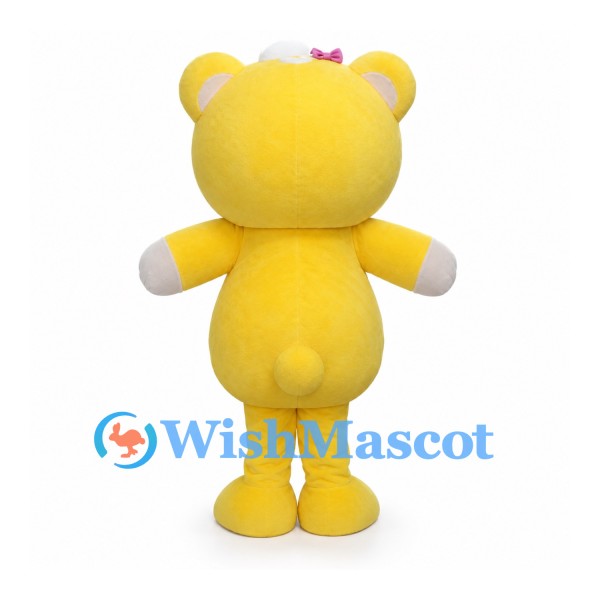 Yellow Bear Character Mascot Costume with Pink Bows and White Face