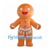 Gingerbread Man Mascot Costume in Orange with White Icing and Pink Buttons